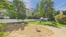 Spielplatz in der Anlage HEGERICH: Moderne 1-Zimmer-Erdgeschosswohnung mit Loggia in Sendling-Westpark!